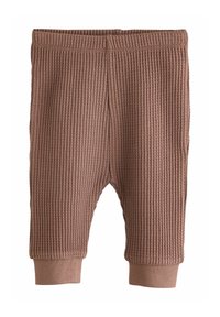 Braune gerippte Hose aus strukturiertem Stoff, mit einem körpernahen Bund und schmal zulaufenden Beinen mit Bündchen an den Knöcheln.