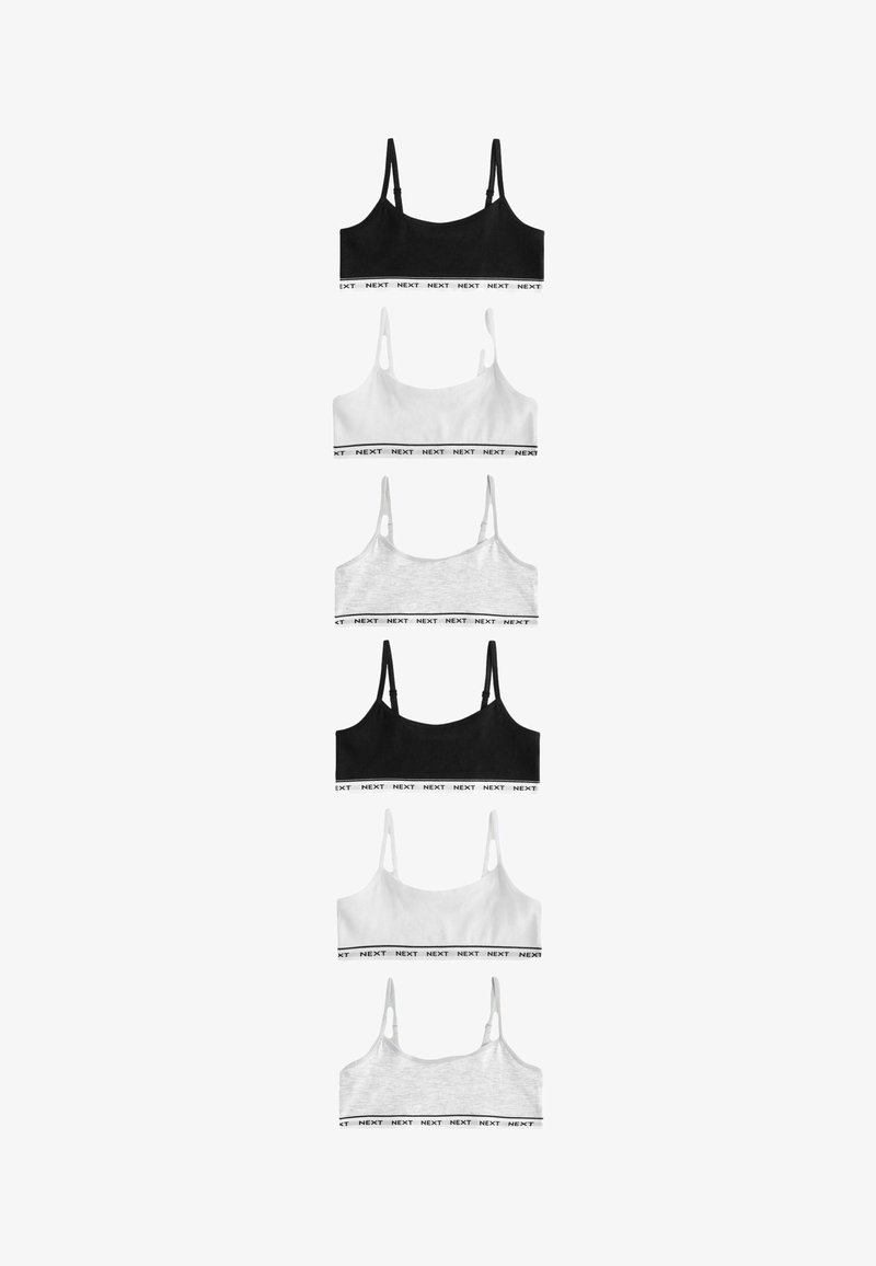 Set von fünf Bralette-Tops in Schwarz, Weiß und Grau. Hergestellt aus weichem Material mit verstellbaren Trägern und kontrastierenden, mit Logo versehenen elastischen Bändern.