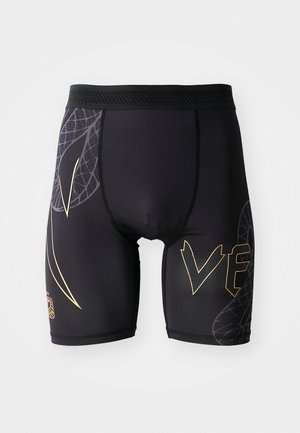 Black athletic shorts made from stretchy material. Features golden accents and a geometric pattern on one side. Elastic waistband design.