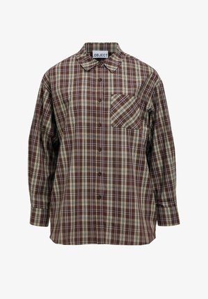 Chemise à carreaux marron avec col et boutons, présentant des accents beige et blanc, et une poche poitrine gauche. Fabriquée en tissu tissé.