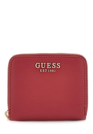 Red textured wallet with zip closure, featuring gold hardware and "GUESS EST 1981" embossed on the front. Rectangular shape.