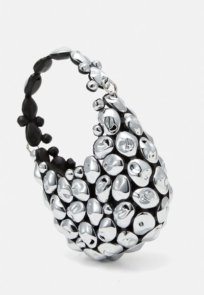 Unique black bag with metallic silver pebble-like textures, smooth surface, rounded shape, and a curved handle for easy carrying.