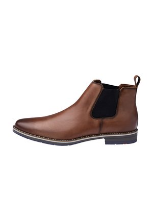 Brauner Chelsea-Stiefel aus Leder mit schwarzem elastischem Seiteneinsatz, Zuglasche an der Ferse, weißer Naht entlang der Sohle und niedrigem, geschichtetem Absatz.