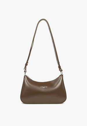 Brown leather shoulder bag with a curved shape, adjustable strap, and silver logo embossed on the front. Smooth texture and minimalist design.