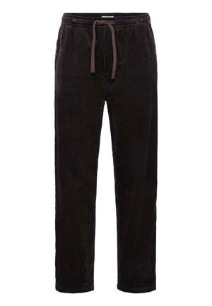Black corduroy pants with a drawstring waist, featuring vertical ribs, relaxed fit, and tapered legs. No visible pockets.