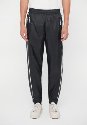 TRAIN GRAPHIC SERIES PANTS MONOGRAM - Jogginghose - black fancy