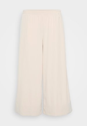 Light beige wide-leg pants made from soft, textured fabric. Elastic waistband with a clean finish at the hem. Simple design without pockets.