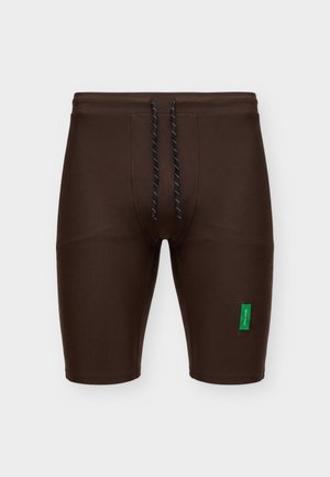 District Vision, Legging court de running - umber