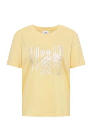 T-shirt jaune à manches courtes avec imprimé feuille de palmier argentée et petit texte "Build Confidence" à l'avant, col rond.