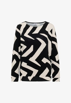 Sudadera en negro y crema con un patrón geométrico de zigzag, cuello redondo, mangas largas y textura de canalé.