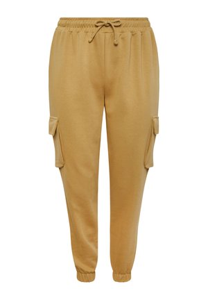 Pantalons de survêtement beige clair avec une taille élastique à cordon, des poignets côtelés et deux poches cargo latérales. Fabriqués en tissu doux et lisse.
