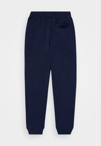 Mörkblå sweatpants med elastiskt midjeband, smalnande ben, ankle cuffs och en enkel invändig ficka på höger baksida.