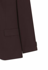 Bordeauxrotes Sakko mit einreihiger Knopfleiste, Stegkragen und zwei Vordertaschen. Ausgestattet mit strukturiertem Stoff und drei Knopfakzenten an den Bündchen.