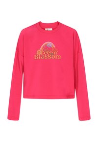 Rózsaszín, rövidítettujjú hosszúujjú pulóver, melyen a "Feelin' Blossom" felirat és virágminták találhatók, kerek nyakkivágással és laza fazonnal.