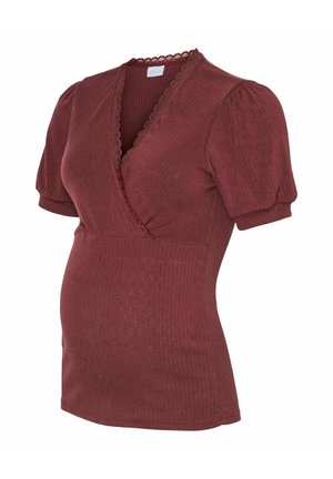 Red ribbed maternity top with short puff sleeves and a deep V-neck, featuring a scalloped trim at the neckline and a fitted bodice.