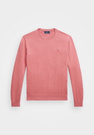 Suéter de gola redonda de mangas compridas em rosa. Feito de um tecido macio com punhos e barra canelados. Pequeno logótipo bordado no peito.