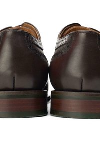Brown leather dress shoes with a smooth finish, featuring decorative perforations, a stacked heel, and polished accents.