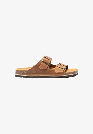 Sandale en cuir marron avec deux brides réglables à boucle métallique, semelle intérieure en liège et semelle extérieure en caoutchouc texturé, vue de profil.