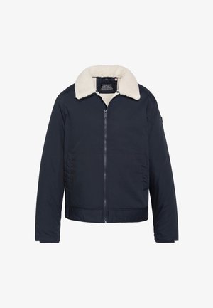 Marineblaue Jacke mit einem Lammfellkragen, Reißverschluss, zwei Vordertaschen und einer strukturierten Stoffoberfläche. Reguläre Passform mit langen Ärmeln.