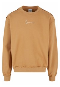 Brun bomulds sweatshirt med rund hals, elastiske manchetter og en frynset kant, med hvidt signaturlogo på forsiden.