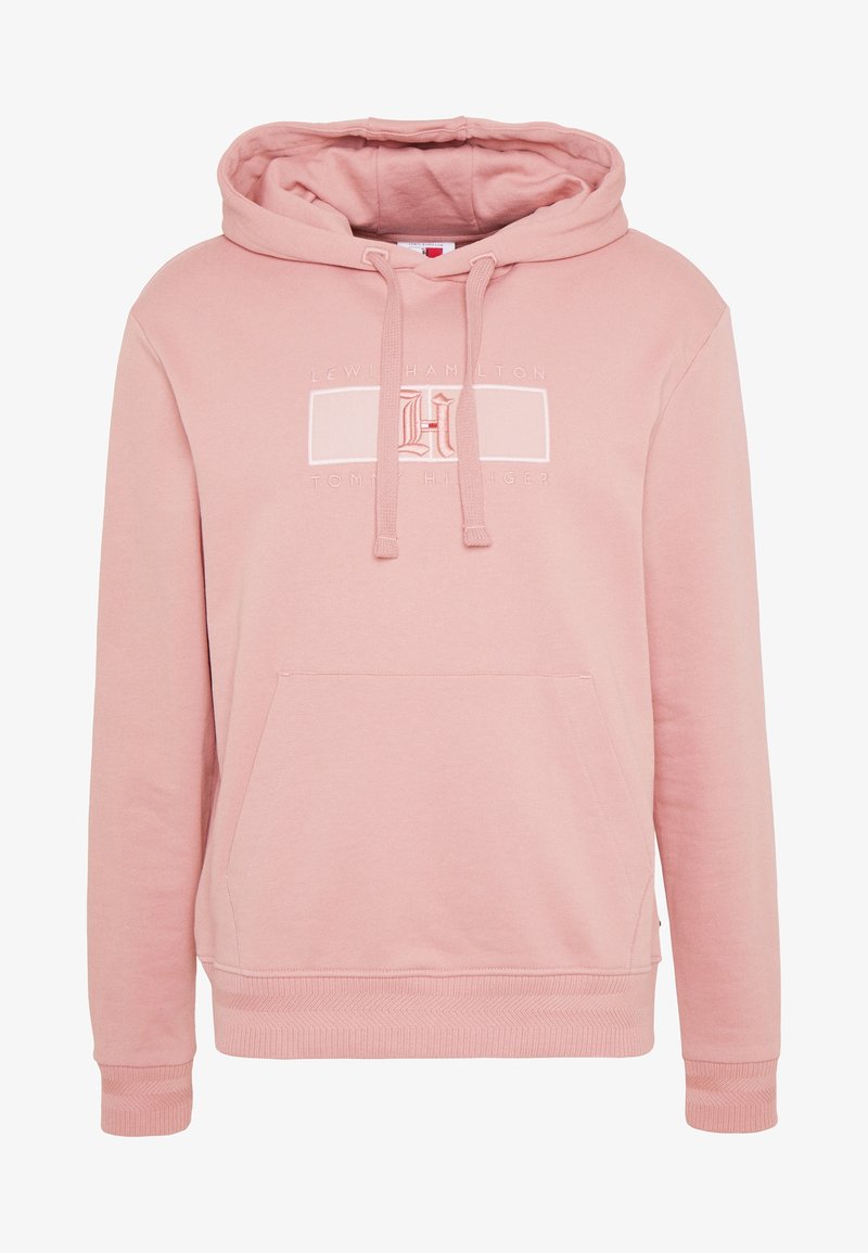 Sudadera con capucha rosa hecha de un tejido suave. Cuenta con un bolsillo frontal y cordones, con un detalle de logo bordado en el pecho.