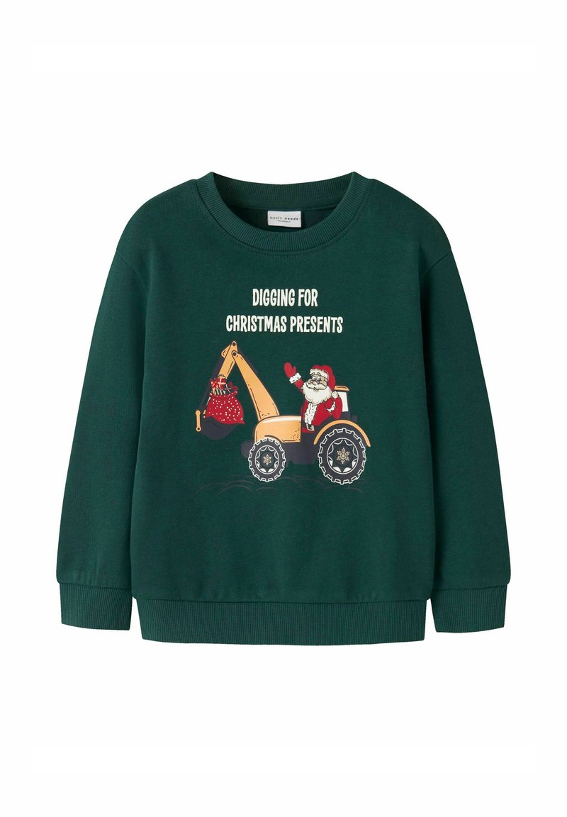Zielona bluza z długim rękawem. Posiada grafikę Świętego Mikołaja w żółtej koparce z czerwoną torbą oraz biały napis „KOPIĄC PREZENTY ŚWIĄTECZNE.”