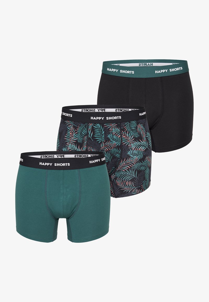 Tre paia di boxer da uomo: verde, nero e un design a fantasia con foglie tropicali, tutti con cinturini elasticizzati etichettati "HAPPY SHORTS."