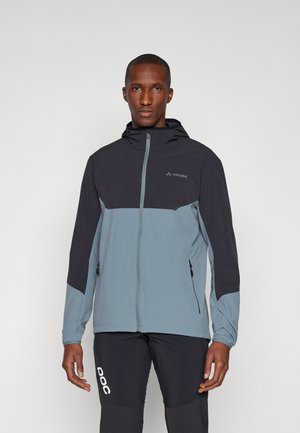 Men's jacket in dark navy and light blue, made of soft-shell material, featuring a front zipper, hood, and zippered pockets.