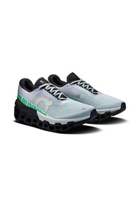 Light blue athletic shoes with black accents, mesh upper, textured design, and a cushioned black sole featuring a distinctive cut-out pattern.
