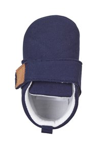 Navy canvas baby shoe with a rounded shape, hook-and-loop strap, white lining, textured exterior, and a tan leather accent.