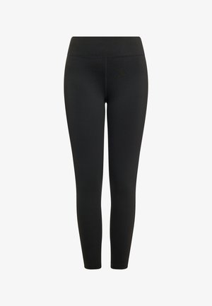 Leggings noirs en matériau élastique avec une texture lisse, dotés d'une taille haute et d'un design moulant.