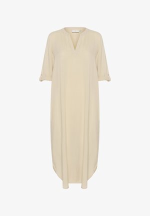 Abito beige con scollo a V, maniche corte arrotolate e spacchi laterali. Realizzato in un tessuto liscio e leggero con una vestibilità ampia e rilassata.