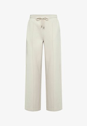 Bézs színű, széles szárú nadrág elasztikus derékrésszel és húzózsinórral, látható függőleges varrási részletekkel az elülső oldalon.