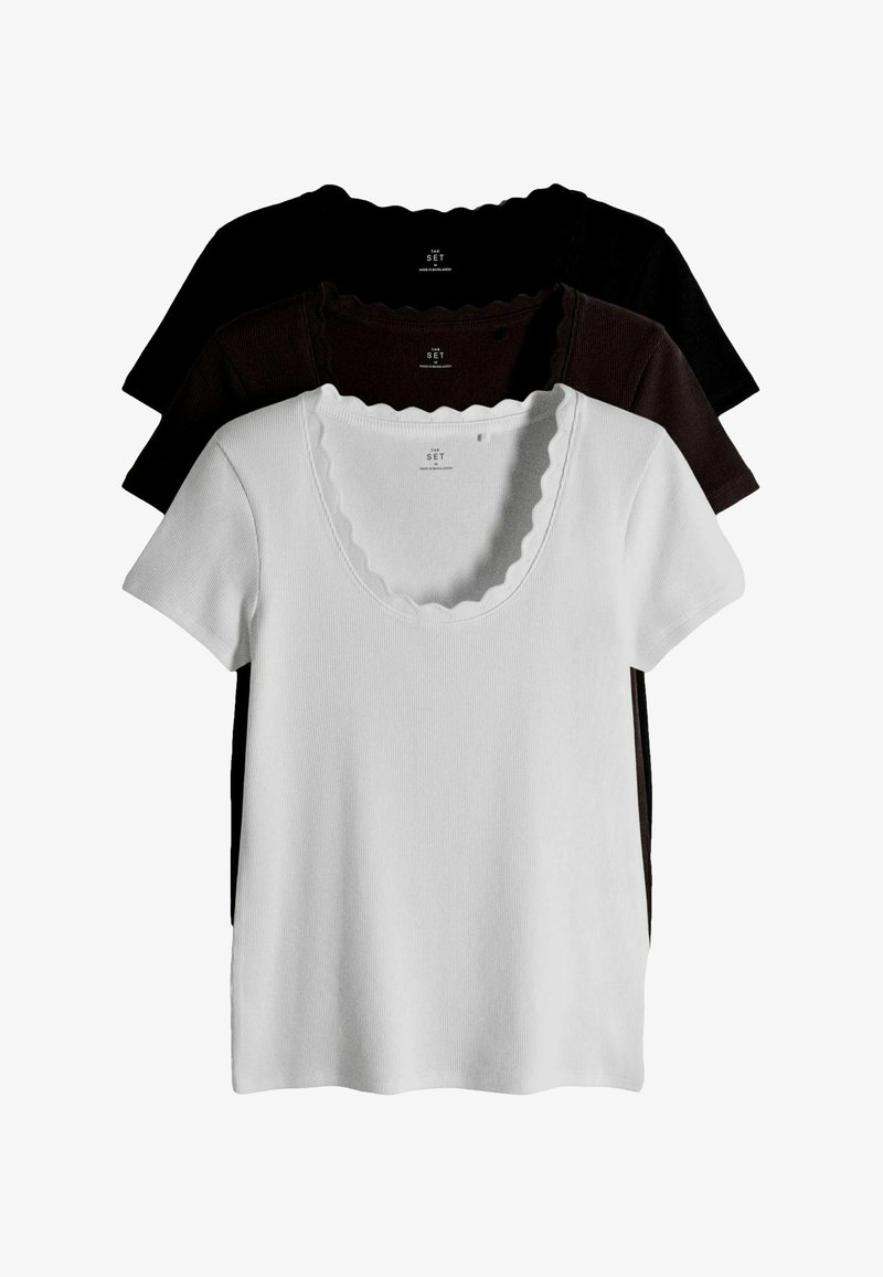 Three short-sleeve ribbed tops in white, dark brown, and black with scalloped necklines stacked on a white background.