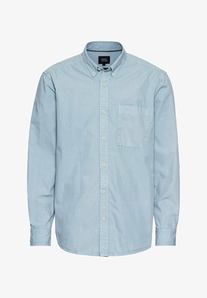 Lichtblauw, langarm overhemd met knopen, gemaakt van katoen. Beschikt over een borstzak en een puntige kraag. Zachte textuur met een gladde afwerking.