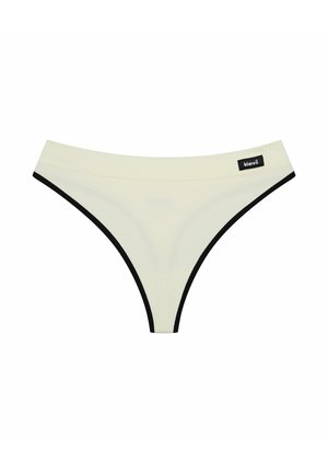 White cotton thong underwear with black trim, featuring a smooth texture and a logo patch on the waistband. Minimalistic design, no patterns.