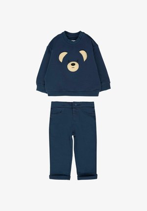 Felpa blu navy con applicazione di un volto d'orso e pantaloni coordinati con polsini. Realizzata in cotone, presenta texture morbide e un design semplice.