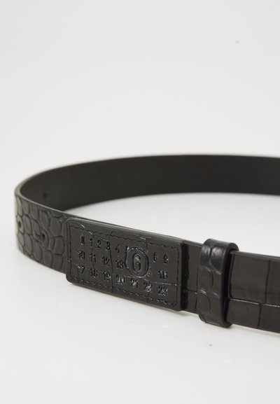 Black faux leather belt with a textured croc pattern, featuring a numbered adjustable buckle for size variation and sleek buckle design.