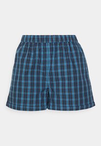 Blå och svart rutiga shorts med elastisk midja. Har en fyrkantig form och mjuk tygtextur. Två sidofickor ingår.