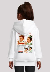 White hoodie featuring retro Kellogg's Corn Flakes advertisement on the back, displaying children with cheerful expressions and vintage typography.