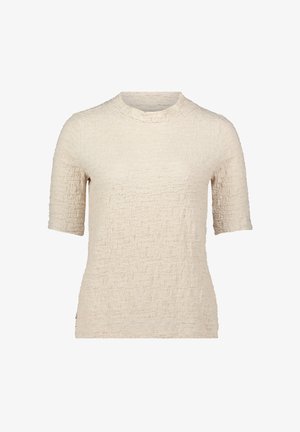 Beżowa bluzka z krótkim rękawem o textured powierzchni, z okrągłym dekoltem i dopasowanym krojem. Materiał wydaje się miękki i lekko pomarszczony.