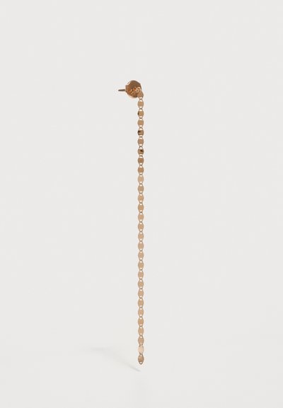 Gold-tone metal earring featuring a long chain design with linked elements, leading to a pointed tip at the bottom. Smooth texture.