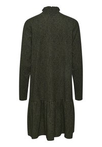 Grön och svart mönstrad klänning med långa ärmar, volangkrage och lagerpå lager nederkant. Tillverkad av mjukt tyg med en strukturerad yta.
