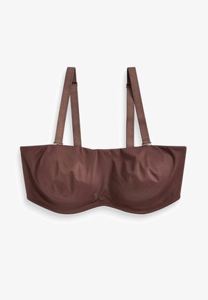 Pruun, polsterdatud rinnahoidja laiemate rihmadega, traadi toestusega ja sileda tekstuuriga. Omab lihtsat, minimalistlikku disaini ilma kaunistusteta.