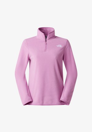 Lichtroze fleece trui met een ritssluiting bij de nek, lange mouwen en een klein wit logo op de linker bovenkant. Zachte textuur en losse pasvorm.