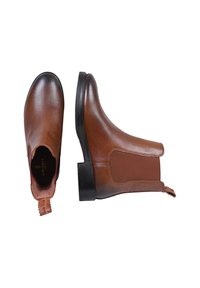 Brązowe skórzane botki za kostkę z elastycznymi panelami bocznymi, okrągłymi czubkami i gumowymi podeszwami. Posiadają uchwyt do łatwego zakładania.