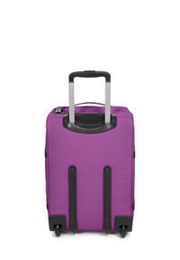 Purple wheeled luggage with a durable fabric exterior, retractable metal handle, and four black wheels. Features a top carry handle.