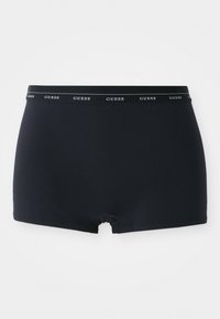 Shorts hipster bleu marine en tissu lisse, dotés d'une ceinture élastique avec logo GUESS et d'une coupe en forme de boomerang au niveau des jambes.