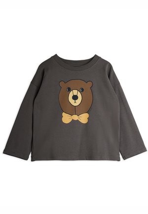 Chemise grise à manches longues en tissu doux, ornée d'un graphique d'ours avec un nœud papillon beige, centré sur le devant.