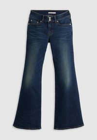 Jean en denim bleu foncé avec jambes évasées, deux poches avant, passants de ceinture et décoloration visible aux cuisses et genoux.